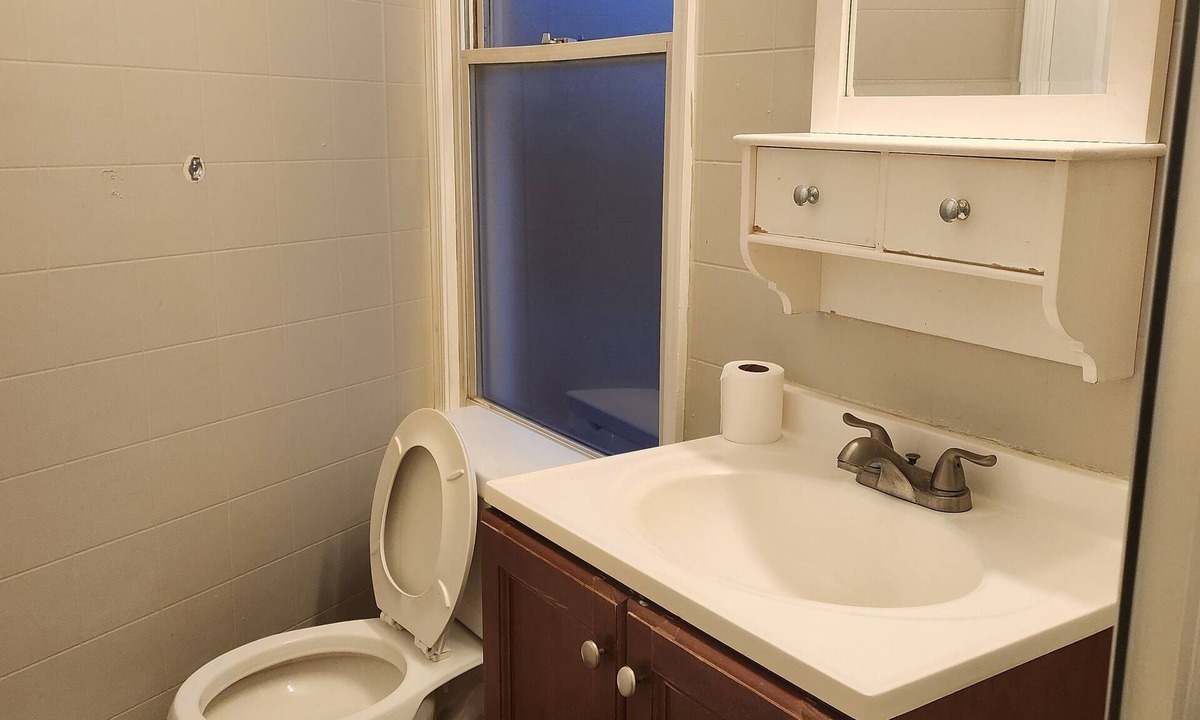 West Baltimore House | 2-bedroom townhome in superb Baltimore with parking and gated yard