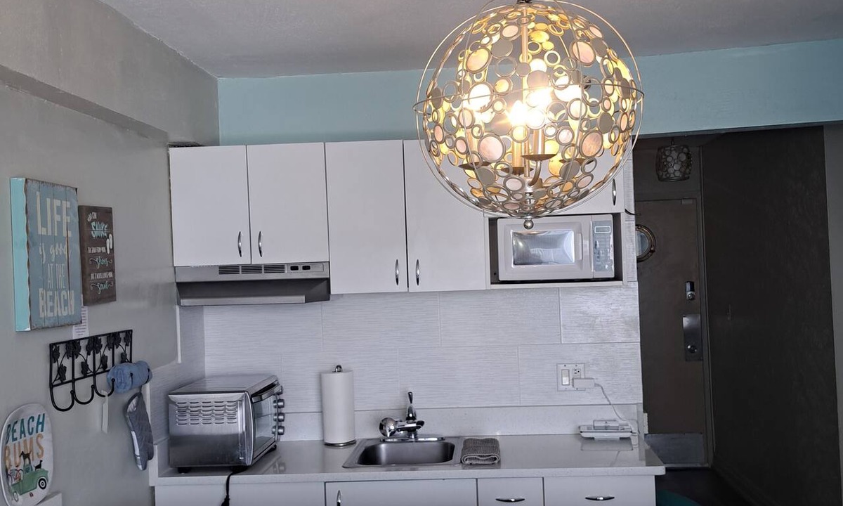 Houghton Daytona Condo | Come chill with us. Enjoy this cozy condo with beach access and a pool.