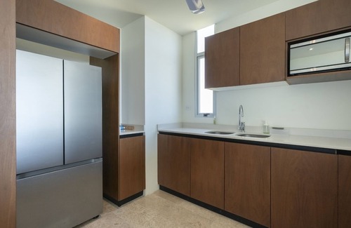 Miramar Apartment | Beachfront apartment with private balcony, heated pool & stunning views