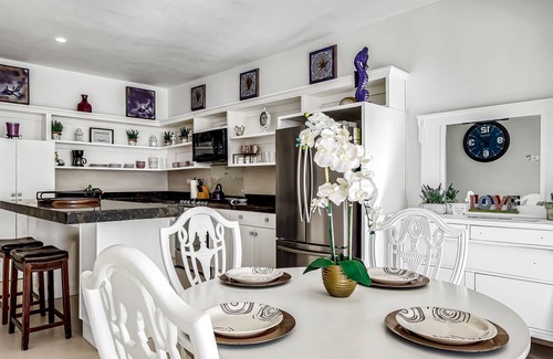 La Paloma House | Dog-friendly oceanfront villa with rooftop patio, pool access, & kitchen