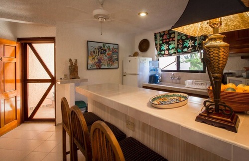 Akumal Condo | Enjoy the ambience of this beachfront condo located in South Akumal!