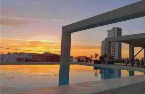 Ferrocarrilera Apartment | Impecable loft, terraza, alberca, cerca de playa