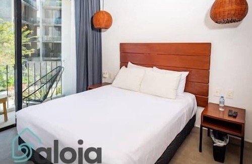 Tulum City Center Hostel | 207 - Suite with balcony and rooftop pool