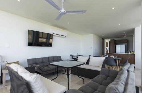 Miramar Apartment | Beachfront apartment with private balcony, heated pool & stunning views