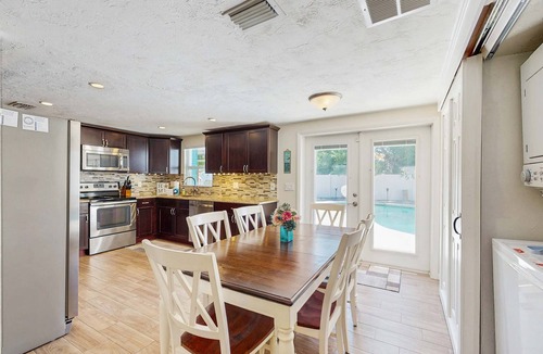 Pinellas Park House | Bright Home with Private Pool High Speed WiFi Firepit Outdoor Bar and Grill