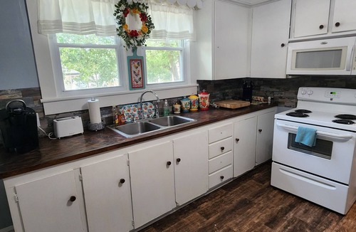 Kannapolis House | Charming 2BR-3bed home with WiFi wooden rockers on porch in wonderful Kannapolis