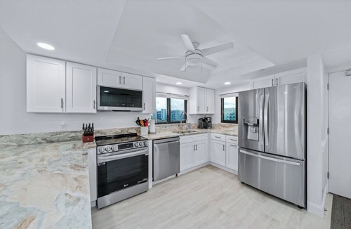 New Smyrna Beach Condo | Direct oceanfront southern corner 2/2 condo with large wrap-around balcony and heated pool