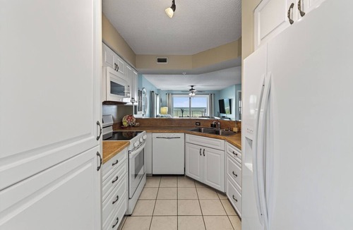 Seawinds Condo Condo | Direct oceanfront 2/2 corner condo with large balcony, heated pool, and garage parking