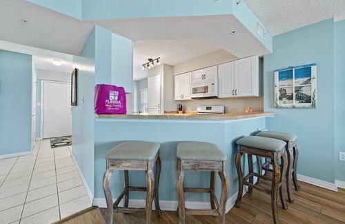 Seawinds Condo Condo | Direct oceanfront 2/2 corner condo with large balcony, heated pool, and garage parking
