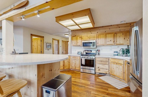 Serene Lakes House | Family-friendly, lakefront getaway with a gas fireplace, furnished deck, & views