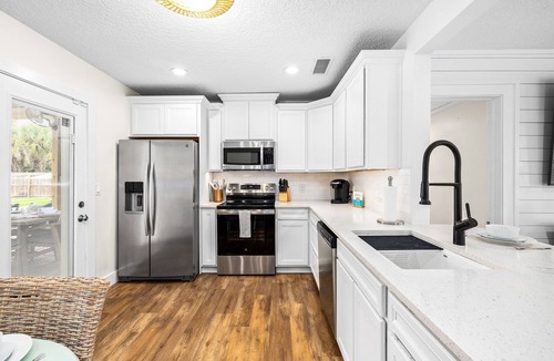 Jacksonville Beach House | Game-On Backyard | Pool, Turf Field & Golf Cart