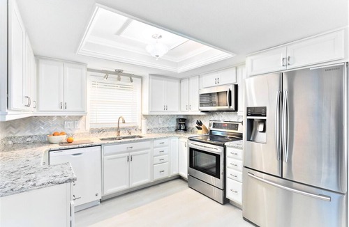 Avon By The Sea Condo | 🌴 Gorgeous Direct Oceanfront Condo l Next to Pier l Private Balcony & Heated Pool!