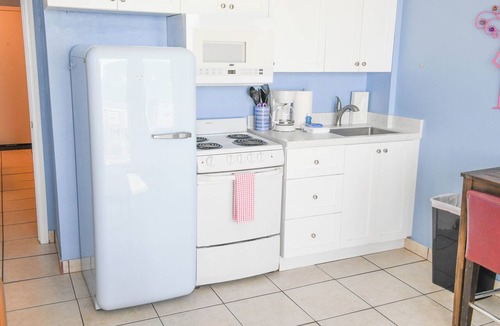 Lenox Park Condo | HBR 213 Flamingo Oasis with pool and hot tub.