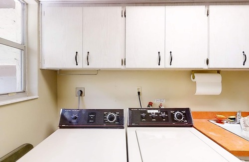 East Lake House | Inviting home with pool, patio, grill, full kitchen, central AC, & W/D