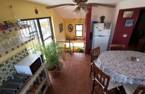 Mauricio Castro House | Large house on a hill with a spectacular view over the sea and mountains