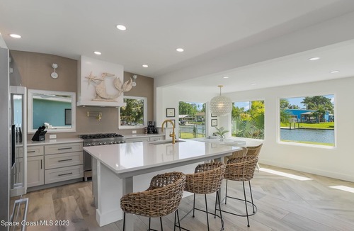 Cocoa Beach House | Luxury Waterfront -Heated Pool, Dock, Bikes & Paddleboards - Mins to Beach
