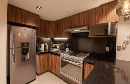 Colonia Cuauhtemoc Apartment | Mid-Century's Morning Embrace: Revel in 'Nowness' Amidst Roma's Radiance.n