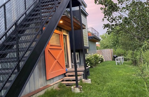 Warwick Apartment | Modern penthouse suite in a restored grain tower with private roof deck.