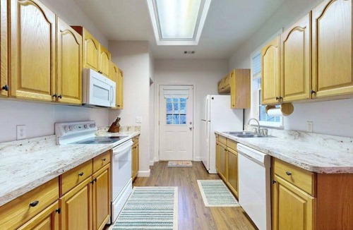 Sylva House | Mountain view home with a fireplace with beautiful view of the creek