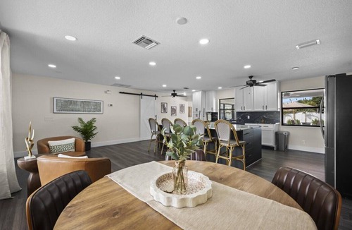 Lake Clarke Shores House | Palm Blanc- Modern Retreat Pool Firepit