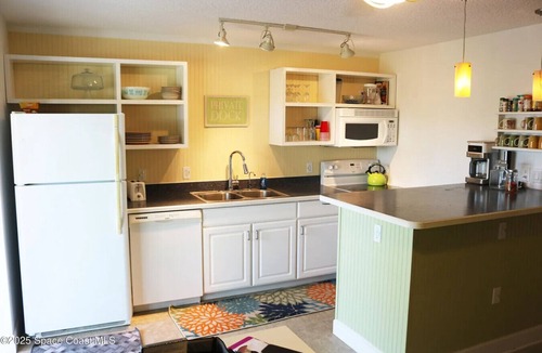 Cocoa Beach Villa | Penguins on the Beach 2BR Steps to Beach & Downtown w/pool Unit 5