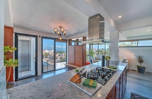 Colonia 5 de Diciembre Condo | Penthouse Condo with Private Rooftop Terrace. Short walk to the Beach & Malecón.