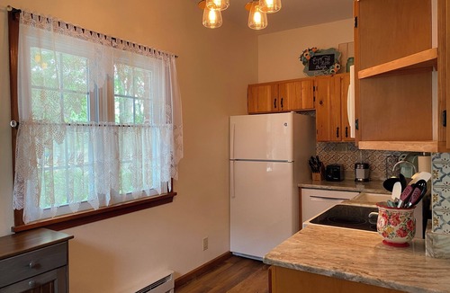Penn Lake Park House | Pocono Lakefront Home- with Private Dock & Swim Raft, Fire Pit, & Boats!