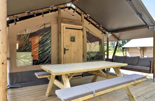 New River RV Rental | Safari Tent Retreat with Riverfront Deck and Nature Stay in Blacksburg, Virginia
