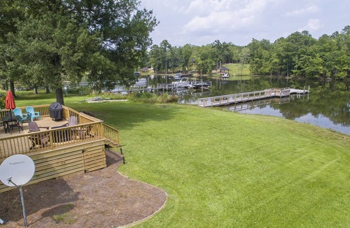Prosperity House | Spacious grounds and home with large deck and dock in quiet cove.