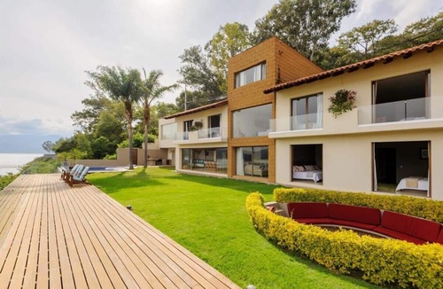 El Santuario House | Spectacular lakefront home with pool
