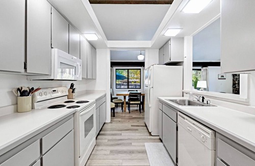 Graeagle Condo | This light-filled alpine retreat blends rustic charm with modern style.