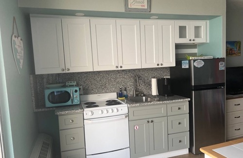 Bostwick Park Condo | Top Floor Oceanfront Studio with Balcony and Pools.
