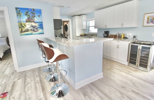 Stuart House | Triple Palm Oasis - Heated Pool with Hot Tub - Stuart