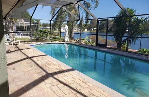 Jasmine Lakes House | Tropical Waterfront Heated Pool/SPA Home by Beach
