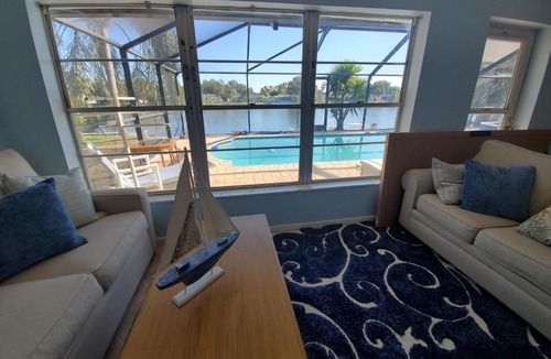 Jasmine Lakes House | Tropical Waterfront Heated Pool/SPA Home by Beach