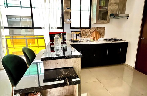 Puebla Apartment | Wonderful view, wooded road and shopping plaza across the street.