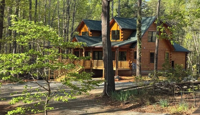 All Decked Out at Pine Haven — a brand-new lakefront log home on Smith Mountain Lake with a private hot tub, 50+ ft of wraparound deck, fire pit patio & easy lake access. Two full kitchens. One of 5 cabins on an 8-acre lakefront micro-resort.