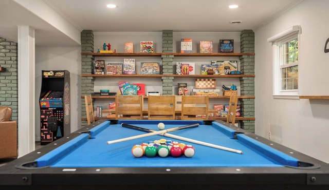 Experience an elevated group getaway in this renovated 3,100 sqft, 5-bdrm 3 bth. Perfect for families, it features a massive 900 sqft game room with a pool ping pong table, wet bar, & much more. Enjoy a luxurious stay with hotel-style amenities.