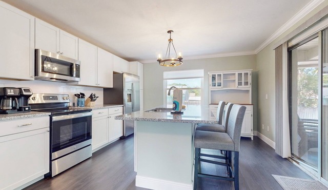 Relaxing Port Orange Home w/Sunroom, Yard & Firepit