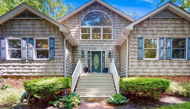 Stunning lakefront retreat w/firepit, game room, & water views
