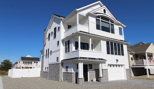 WASH115 | Breathtaking custom coastal 5BR 4ba home! Saltwater pool, cabana rm, views & more!