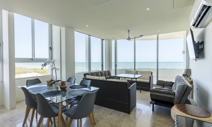 Miramar Apartment | Beachfront apartment with private balcony, heated pool & stunning views